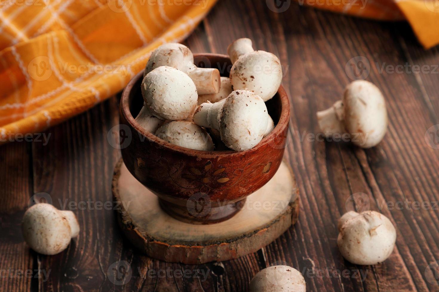 Mushrooms in a wooden bowl photo