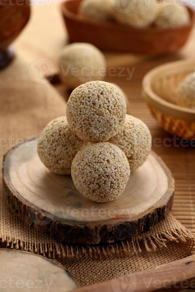 Chaulai ke ladoo on a wooden slice vertical view photo