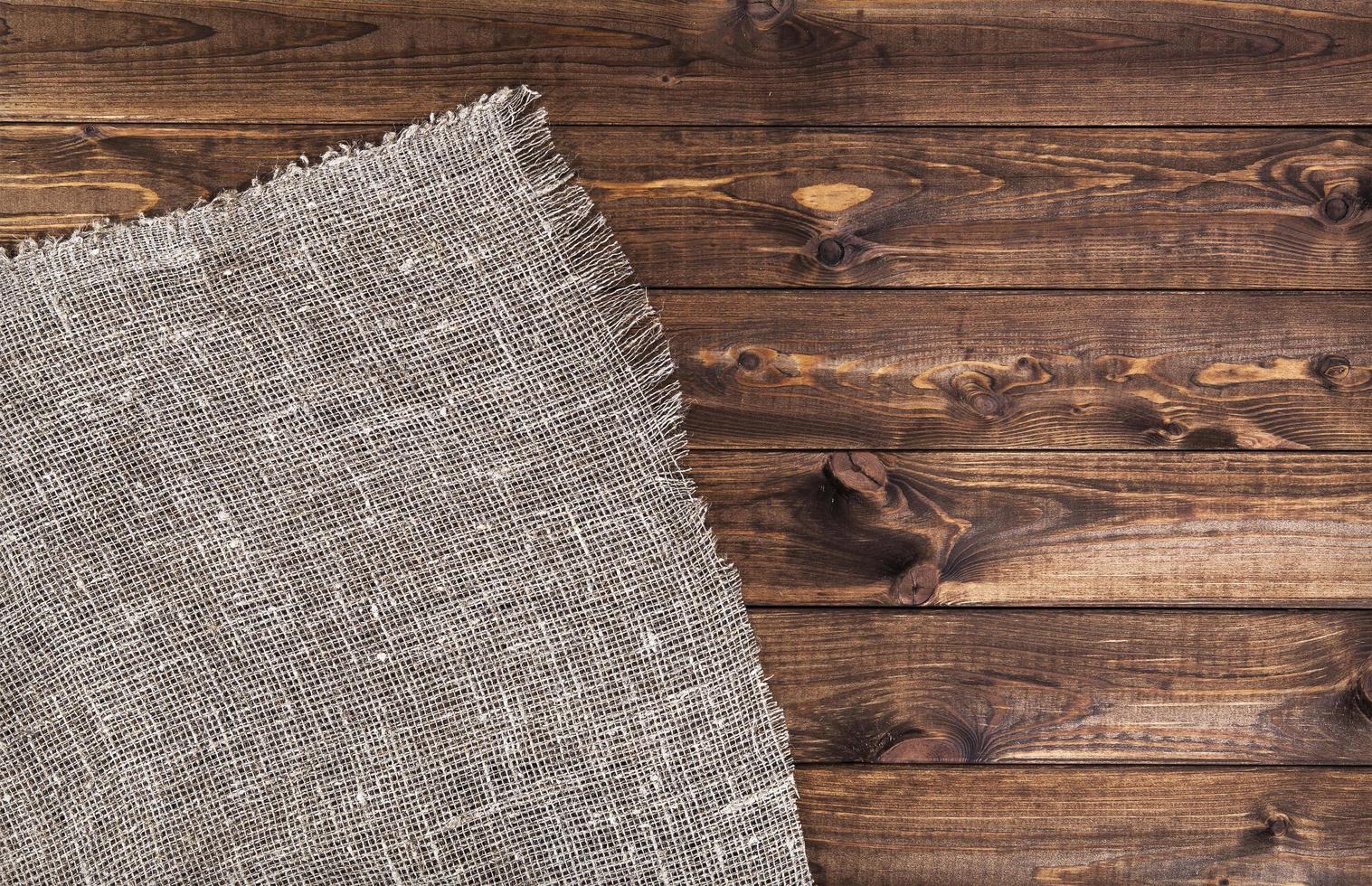 Empty wooden table with tablecloth photo