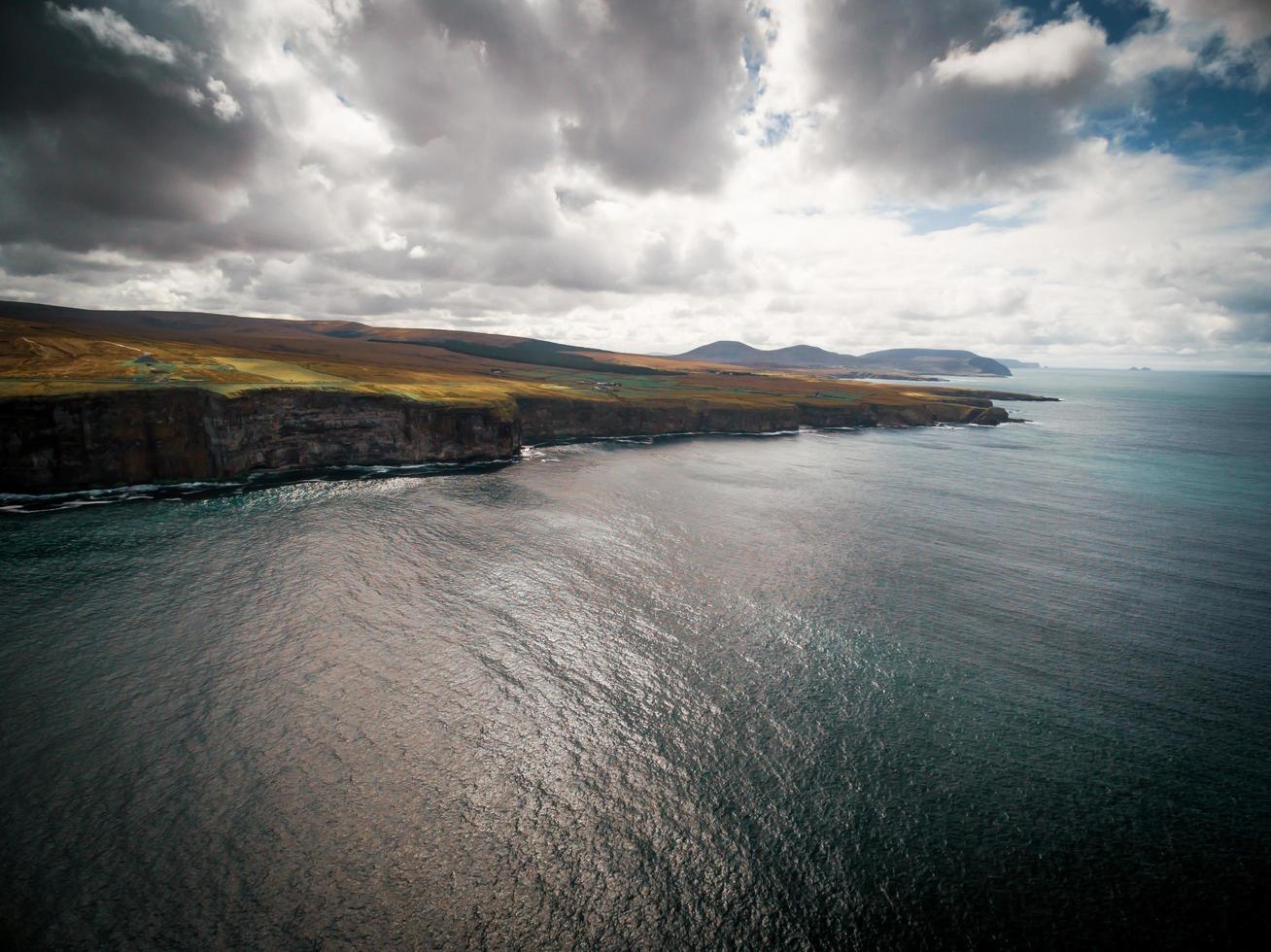 Dramatic aerial view of the cliffs off the Irish coast photo