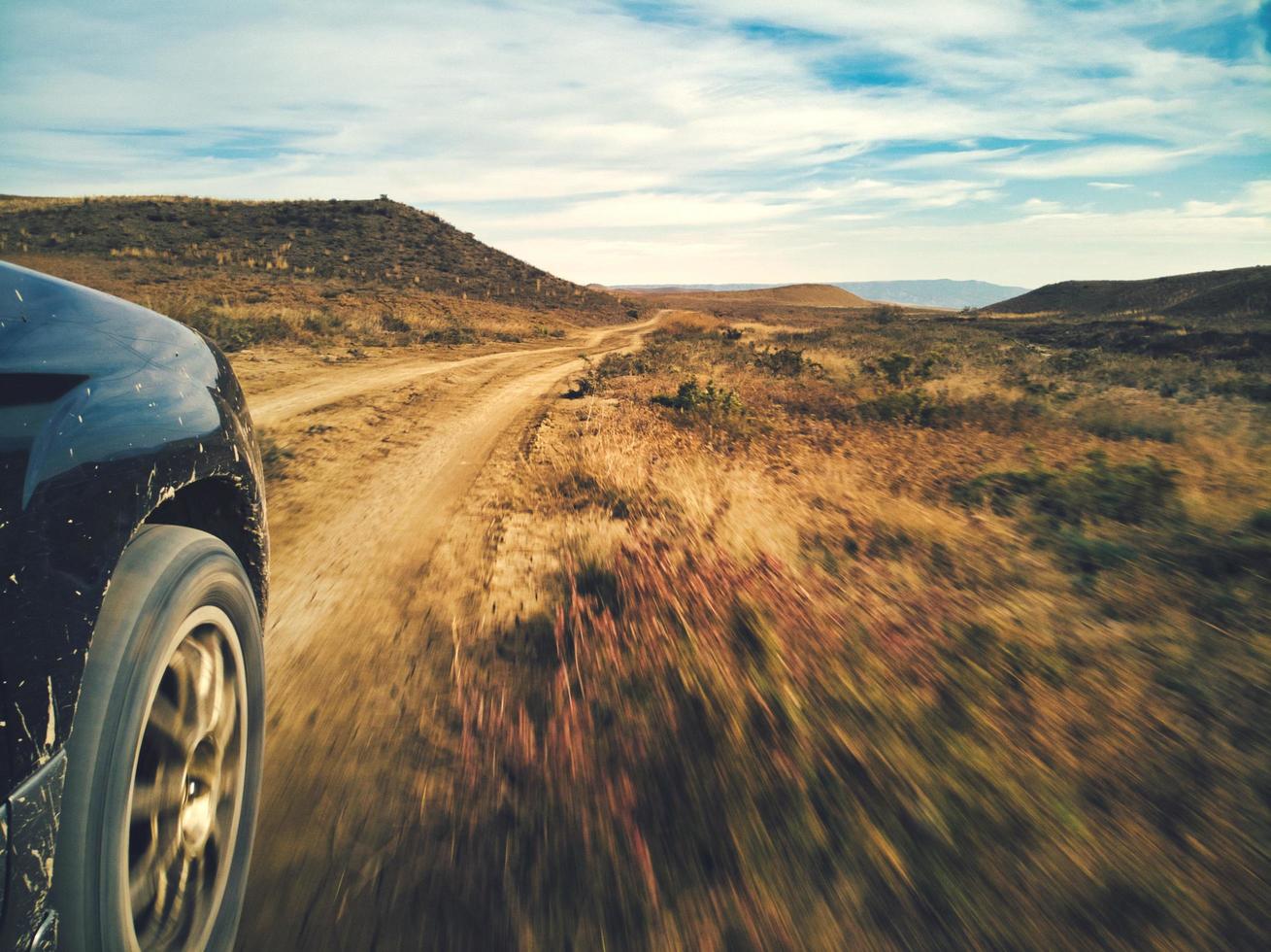 Car on a dirt road photo