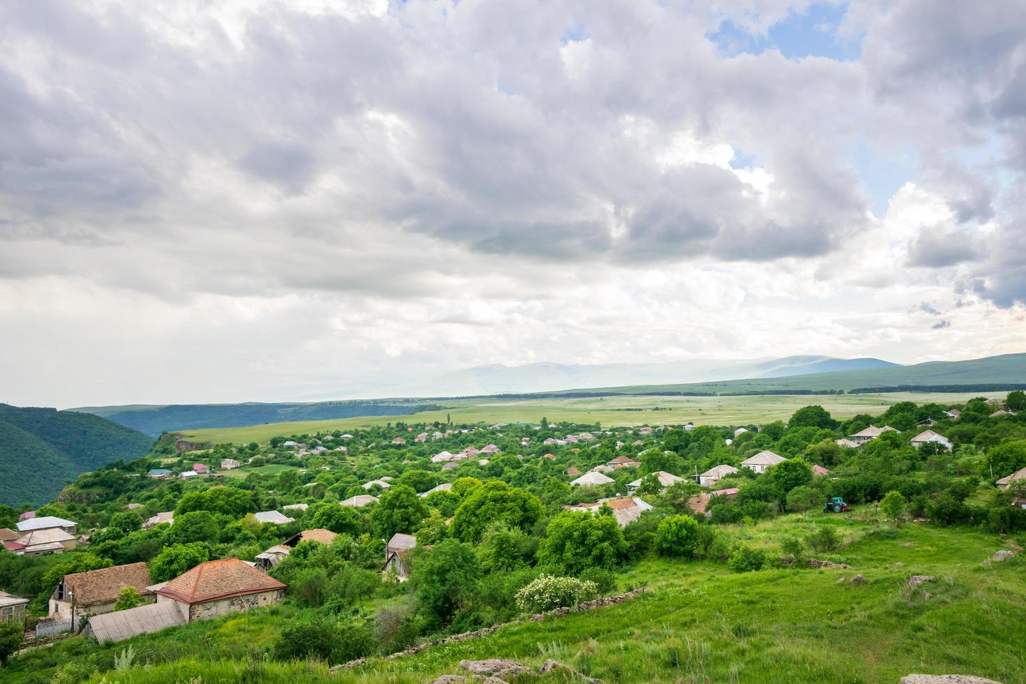 Village houses with green trees photo