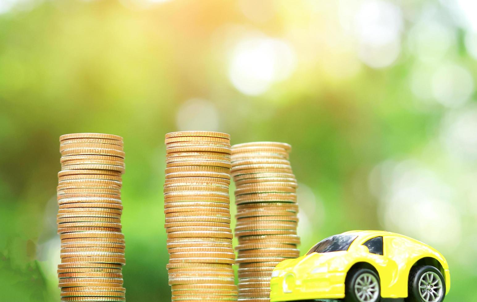 Car and coin natural blurred background. Concept of car insurance photo