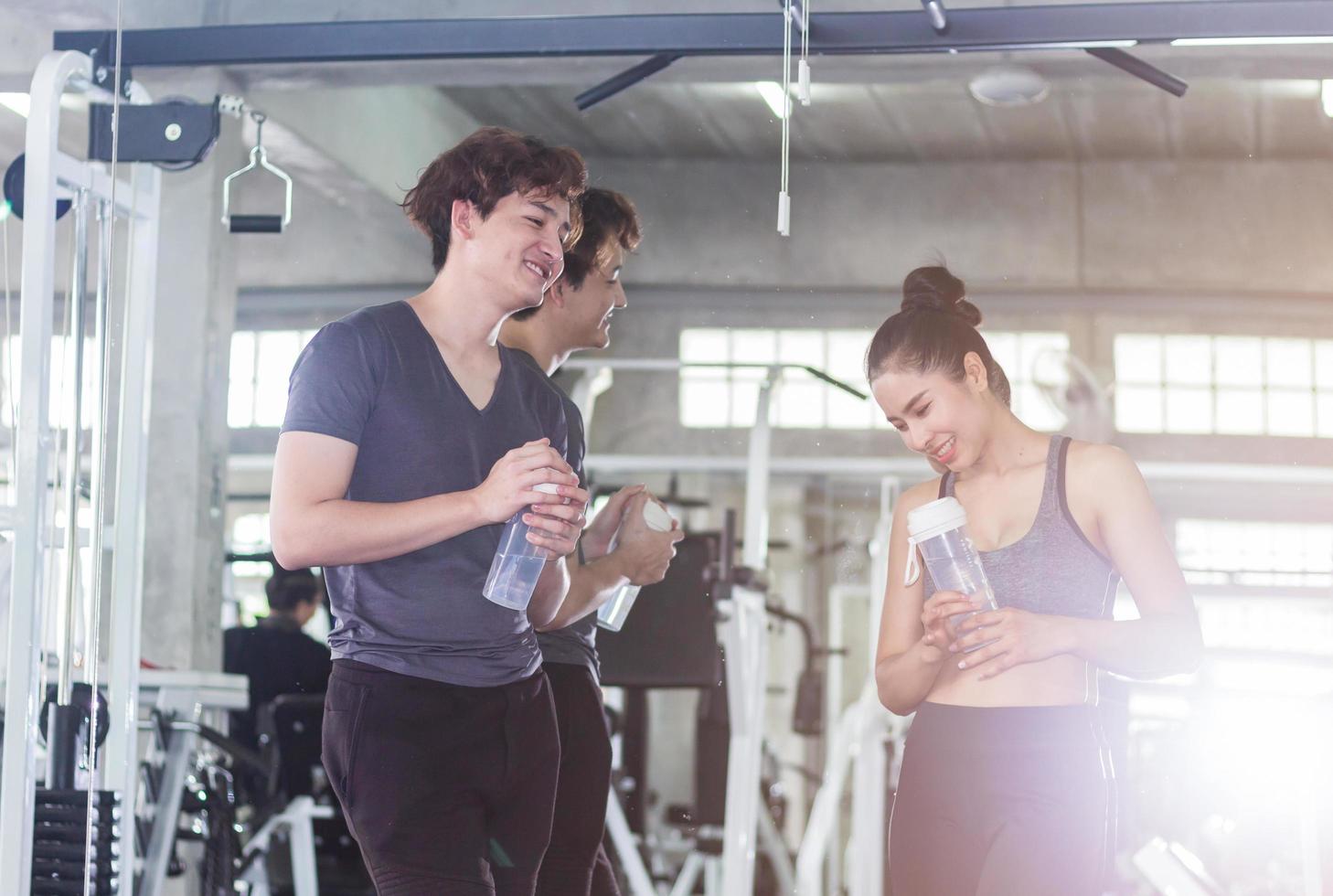 Young Asian couples are exercising in the gym. Concept of exercise for good health of the new generation. photo