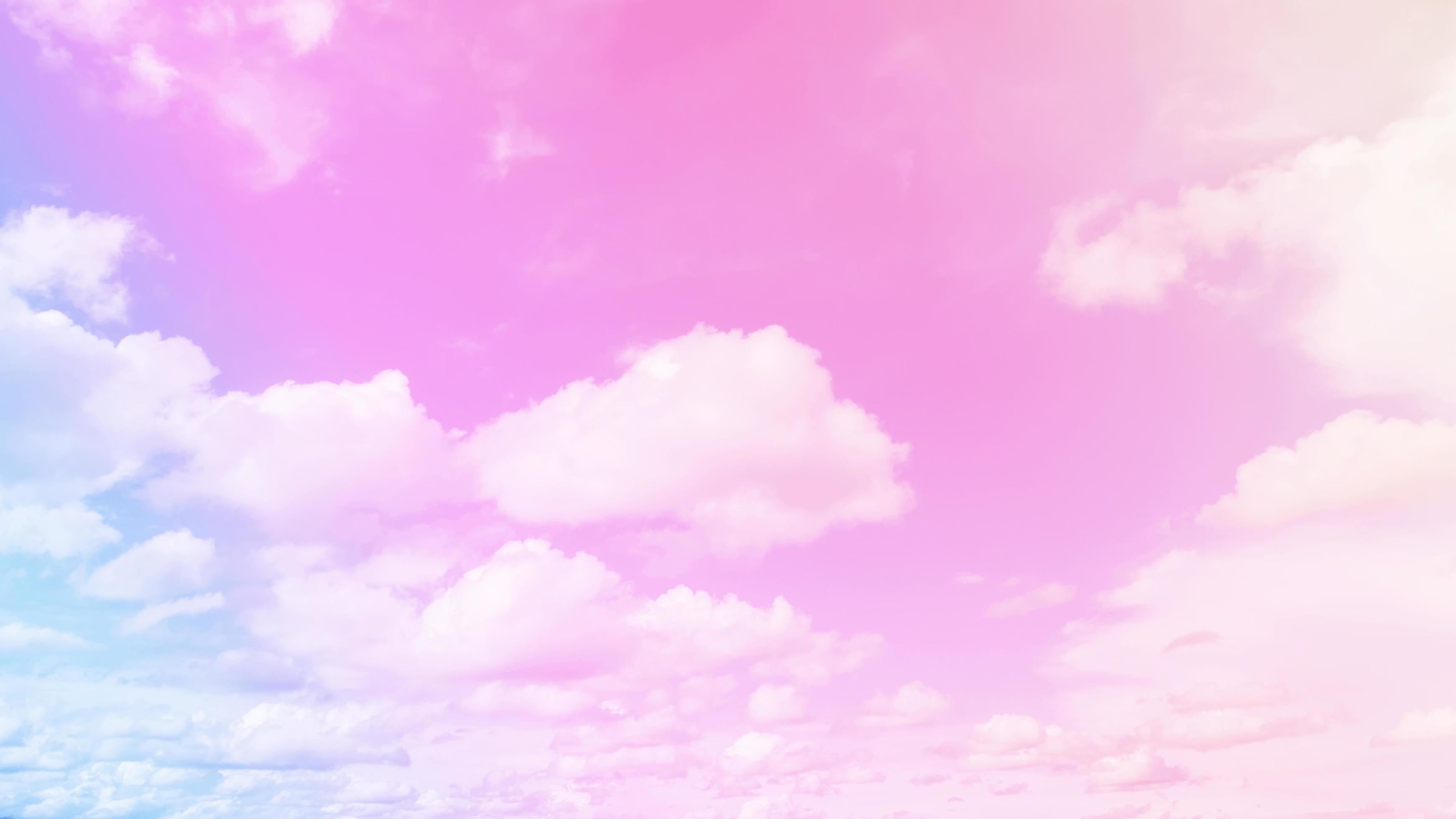 Pink pastel sky and clouds background. Pink and white pastel sky