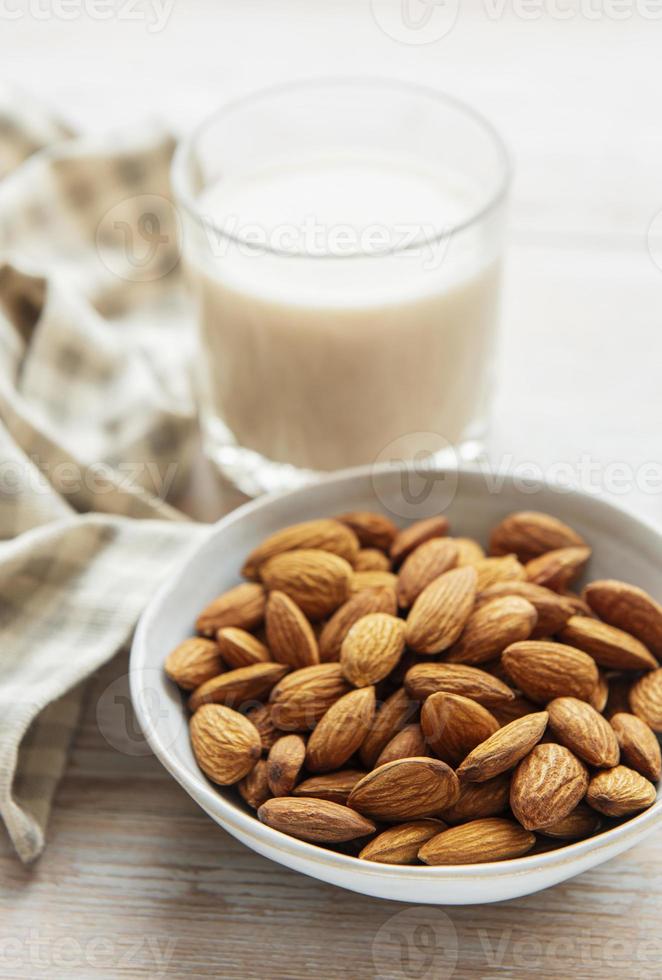 Almond milk and almonds photo