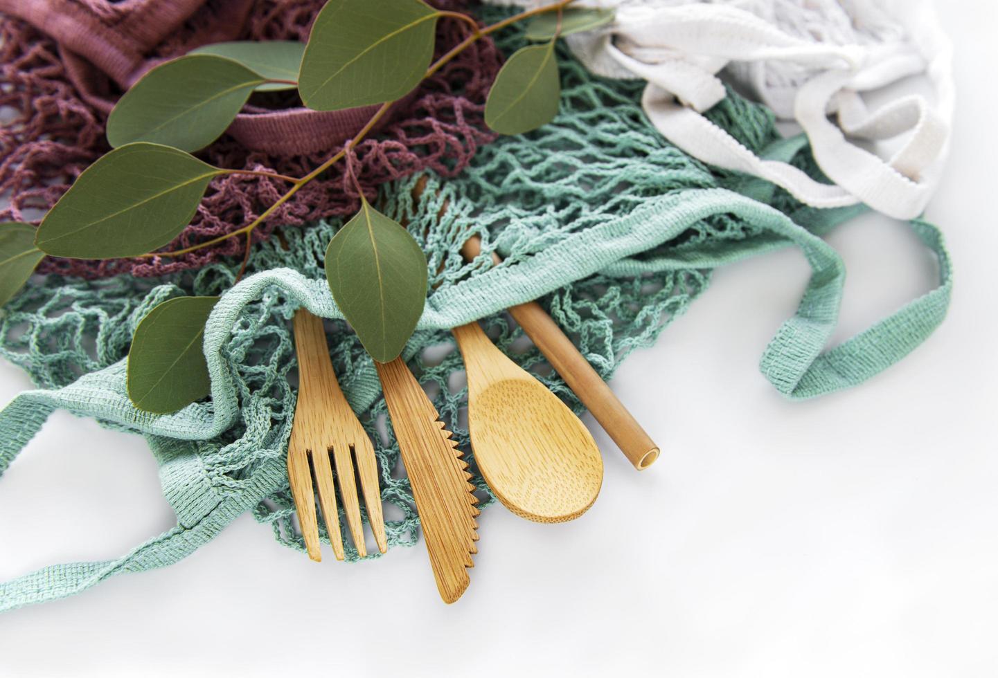 Mesh bag and bamboo cutlery photo