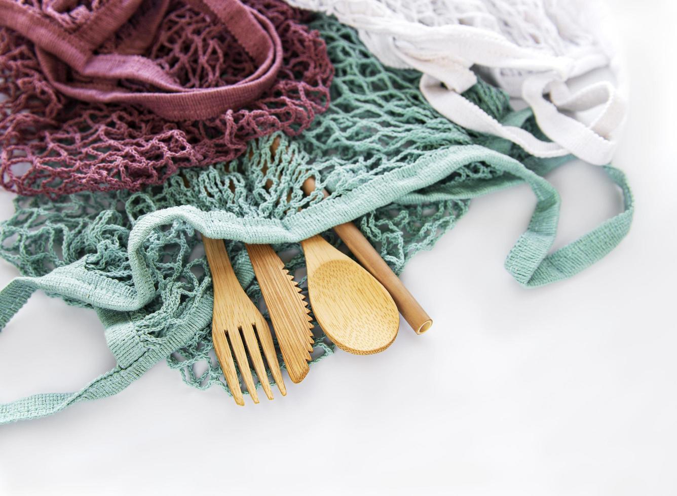 Mesh bag and bamboo cutlery photo