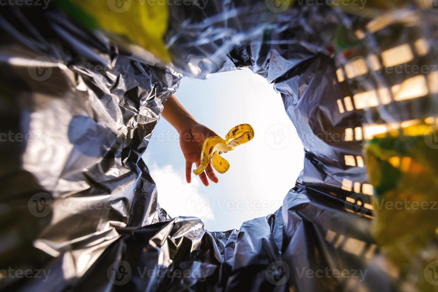 Banana peel was thrown into the garbage bag for disposal. Look from the inside of the basket. photo