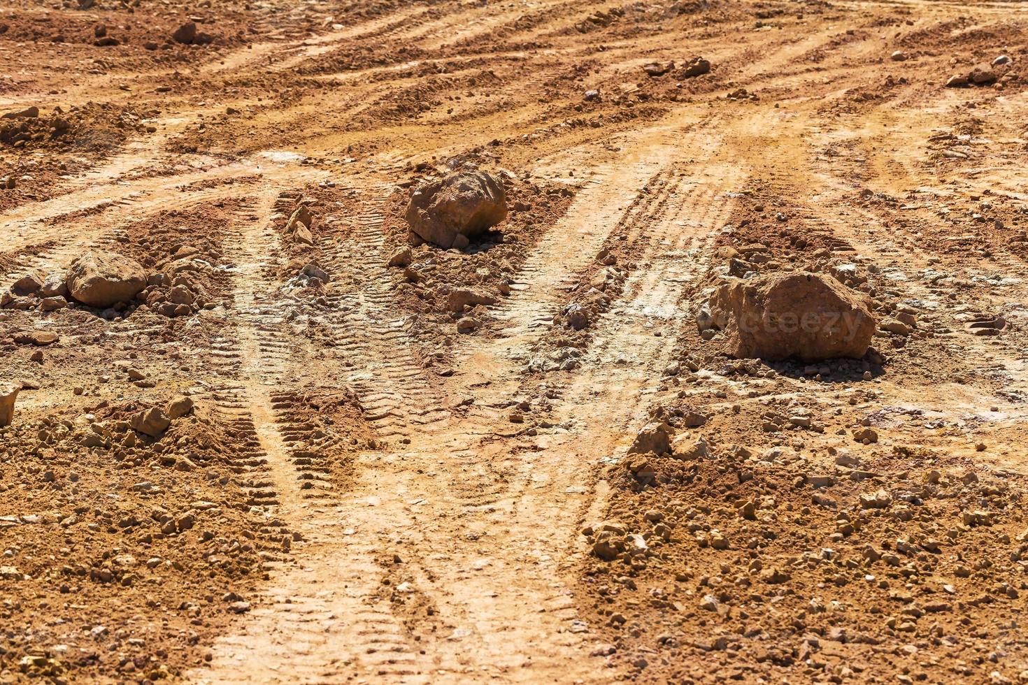 Tired track on the ground. Perspective view. photo