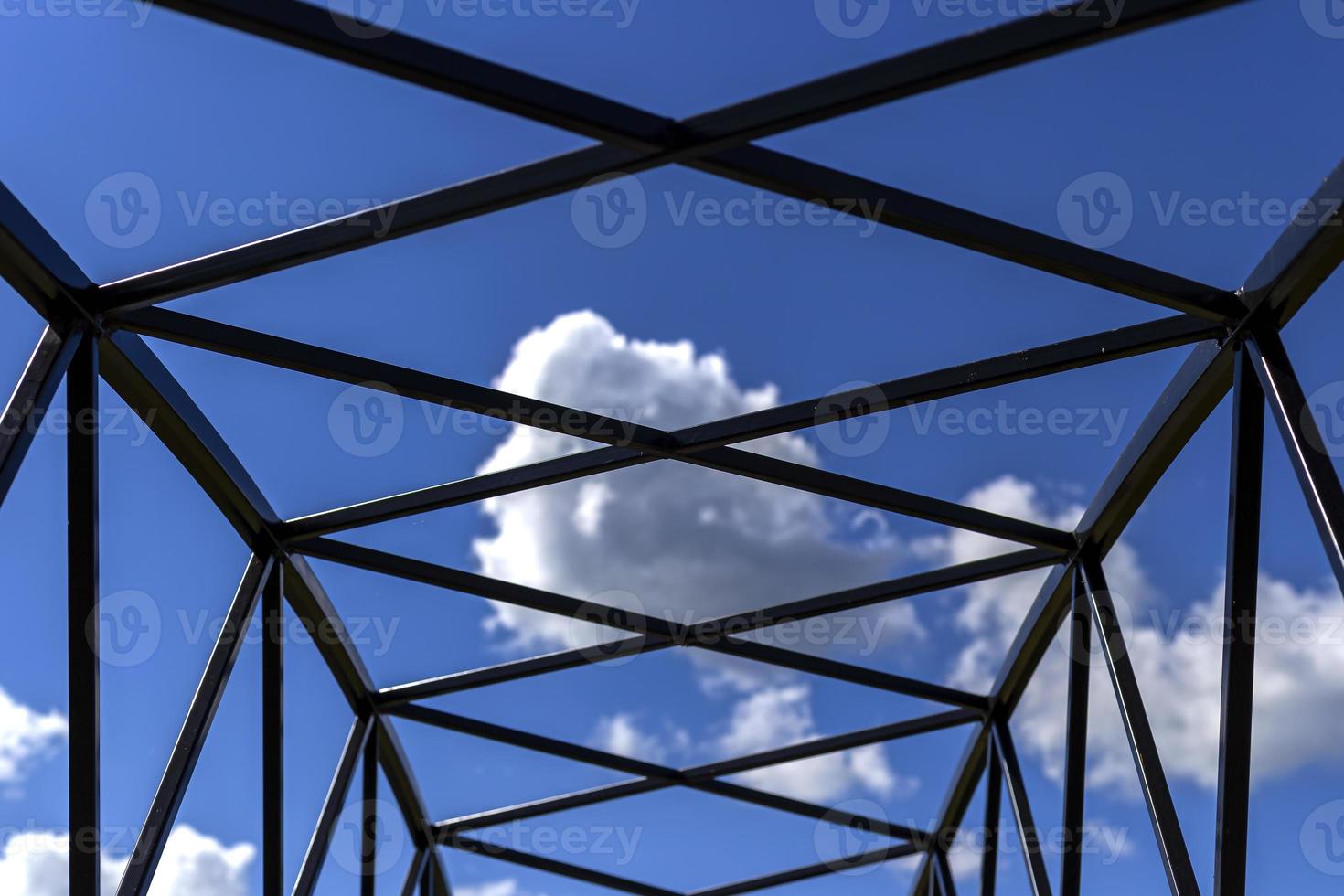 Silhouette of metal frame and blue sky background. photo
