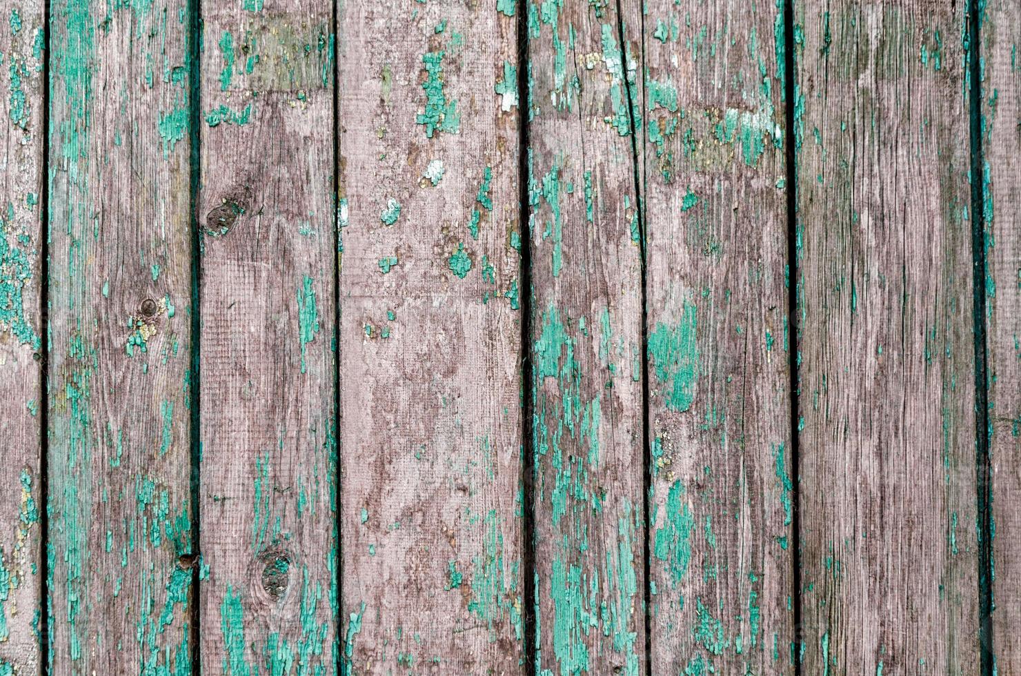 Old wooden planks with green paint photo