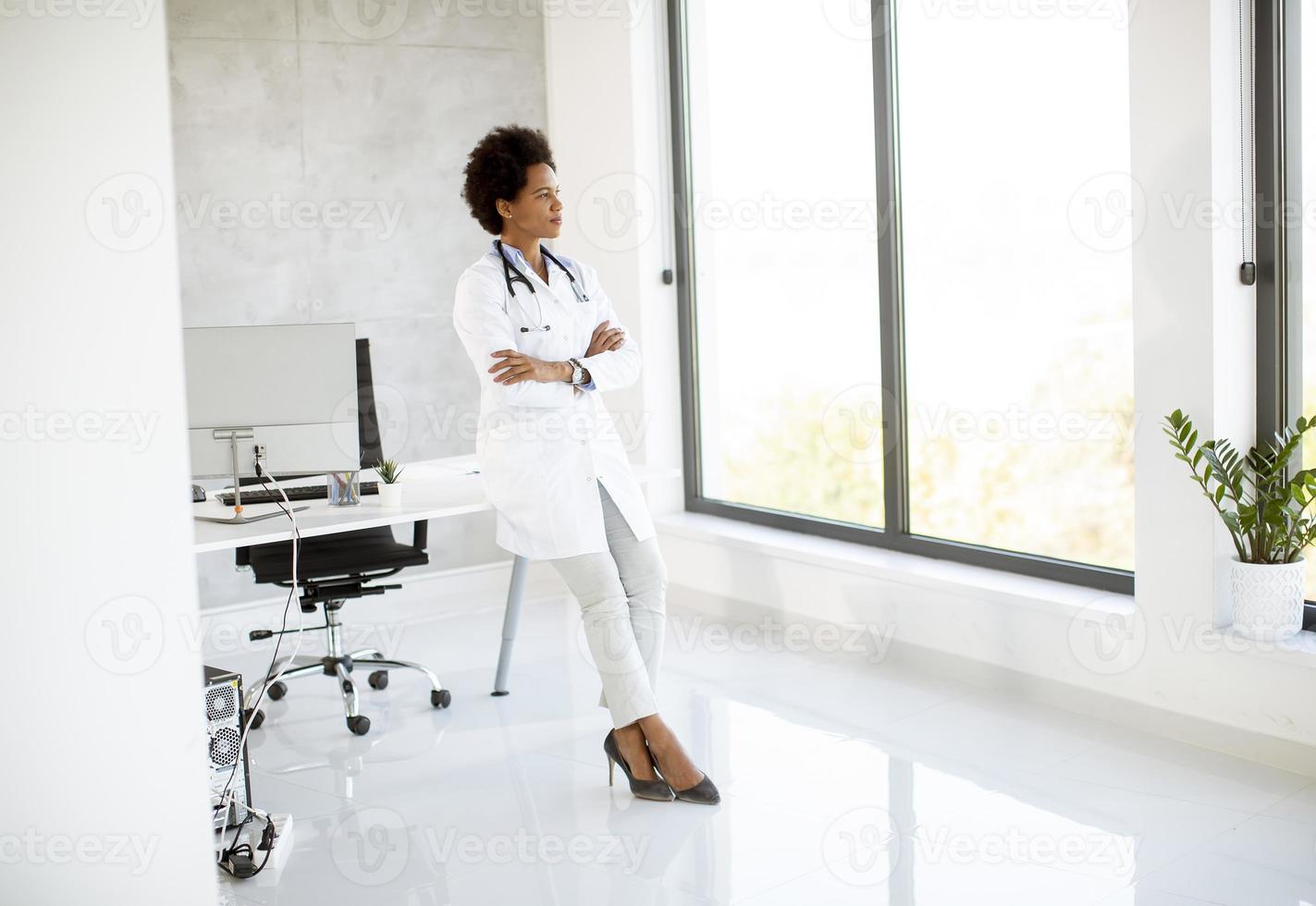 Doctor looking out a window photo