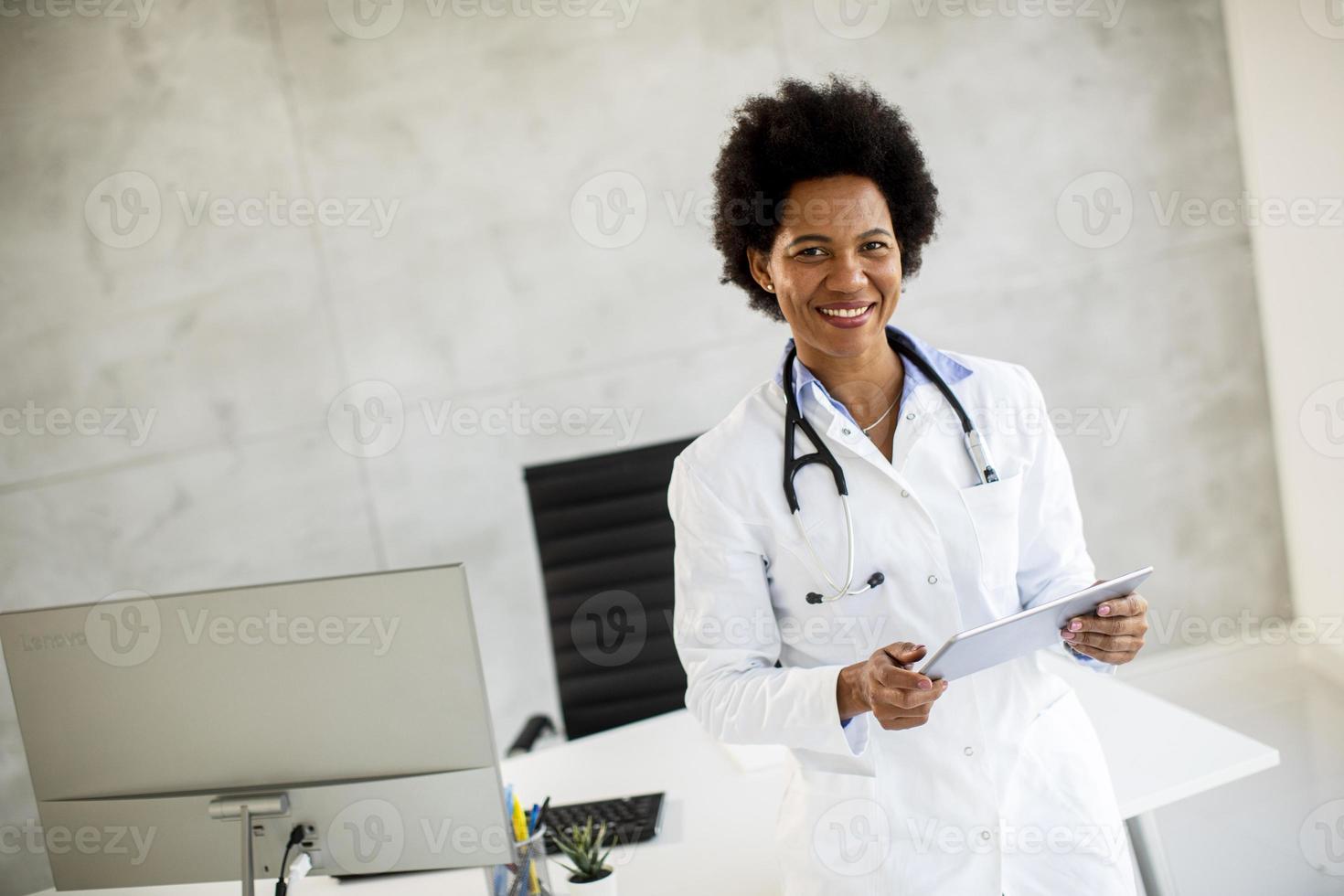 Doctor holding documents and smiling photo