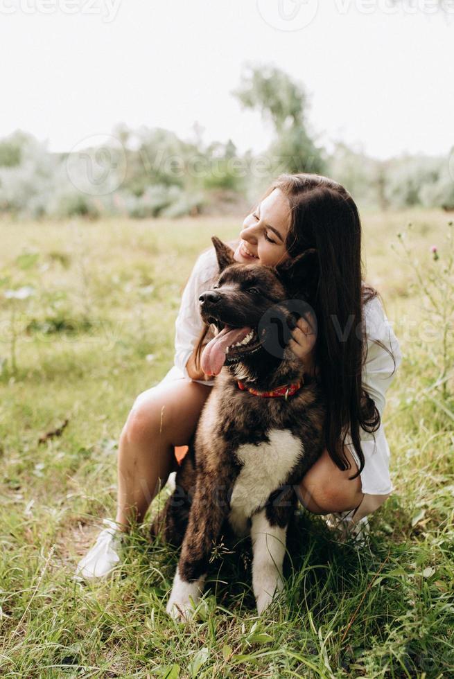 Big dog for a walk with a guy and a girl photo