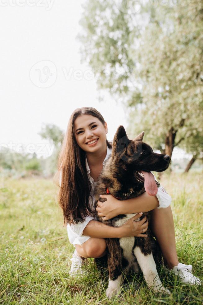 Big dog for a walk with a guy and a girl photo