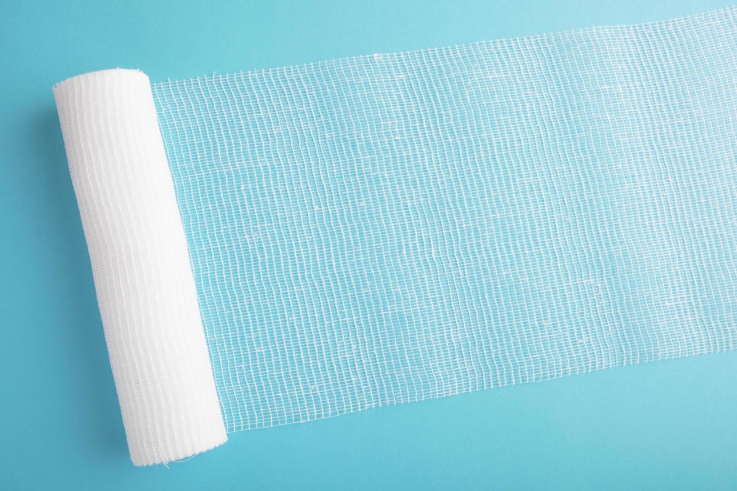 White sterile bandage on bright color background photo