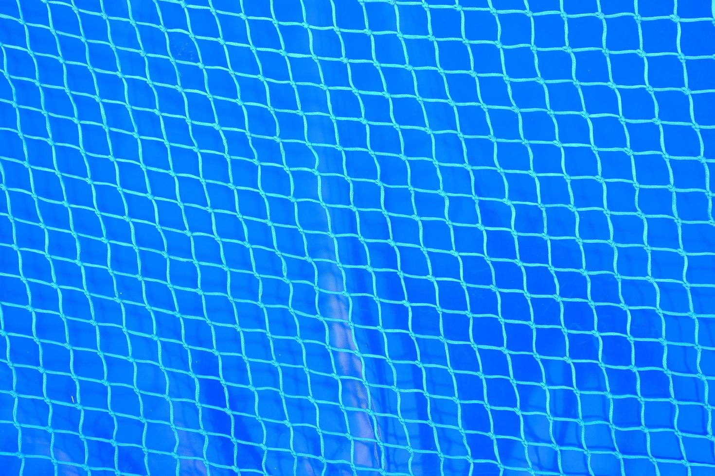 Blue plastic net background photo