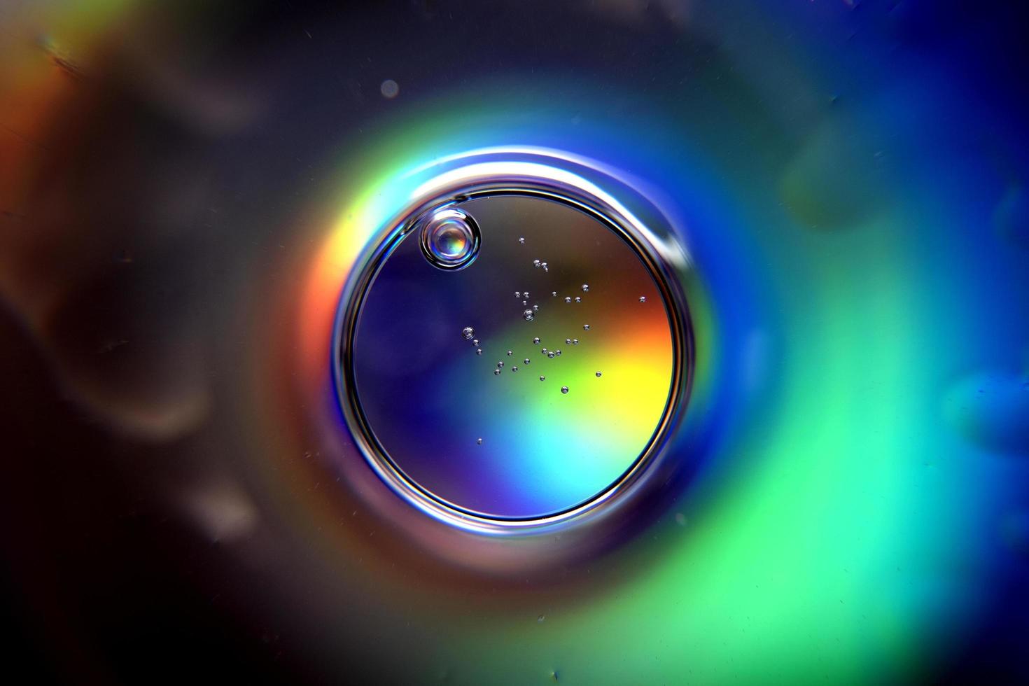 Abstract circle with spectral colors and bubbles photo