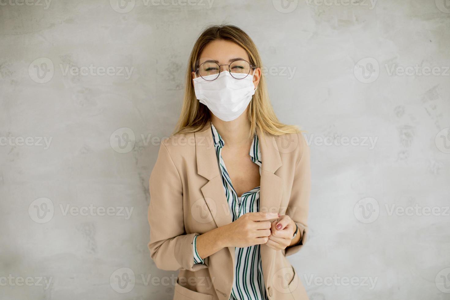 Businesswoman in glasses and mask photo