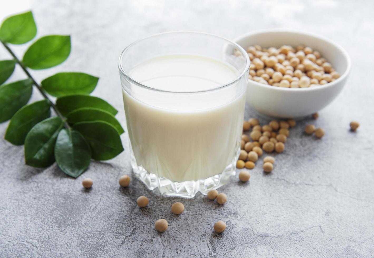Soy milk and soy on the table photo