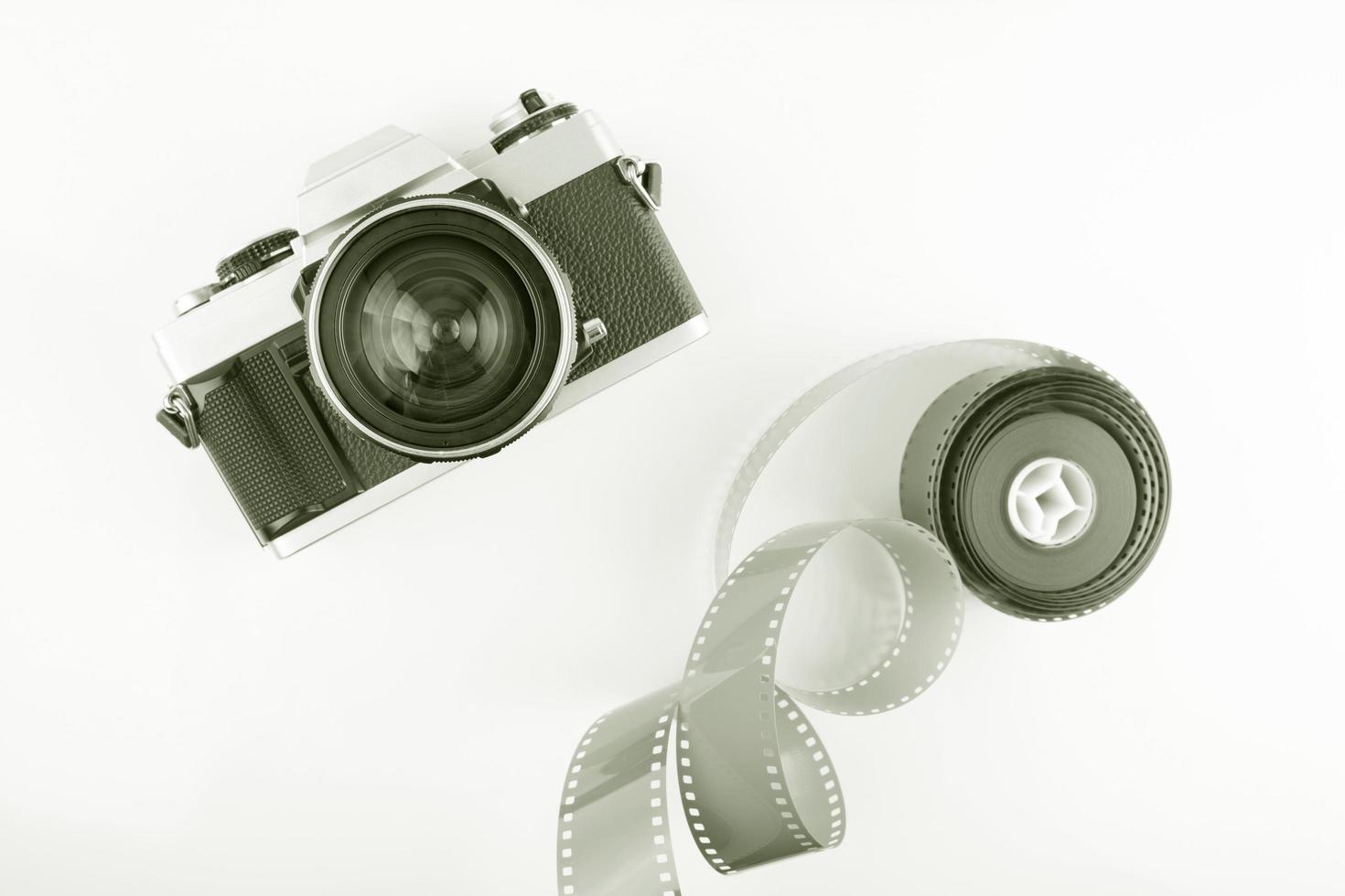 Vintage film camera with a roll of film photo