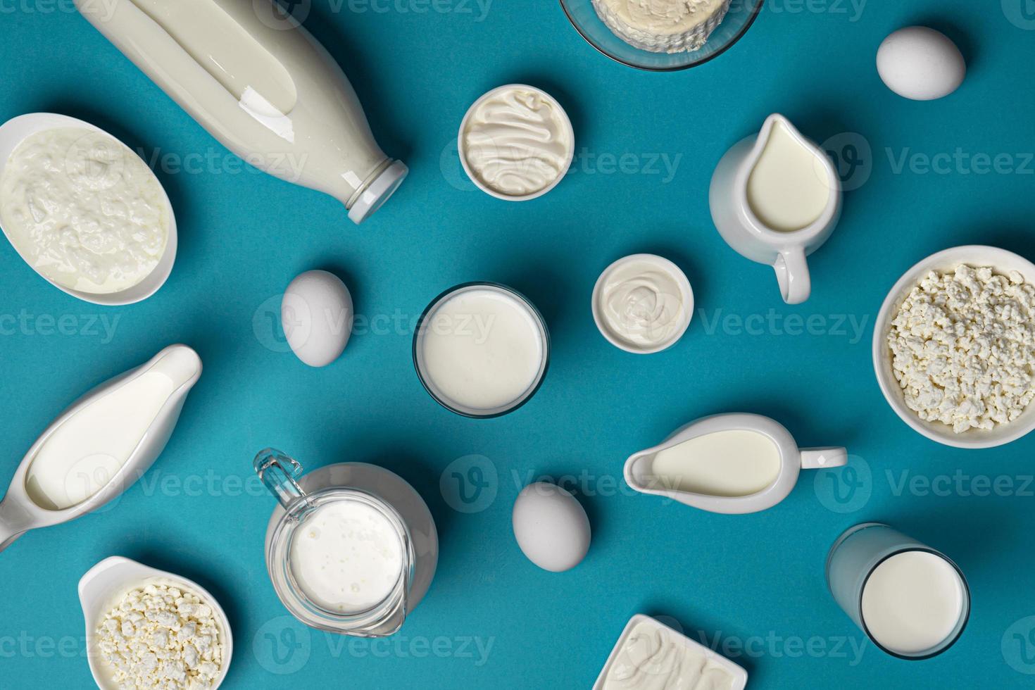 Collection of dairy products on blue background top view photo