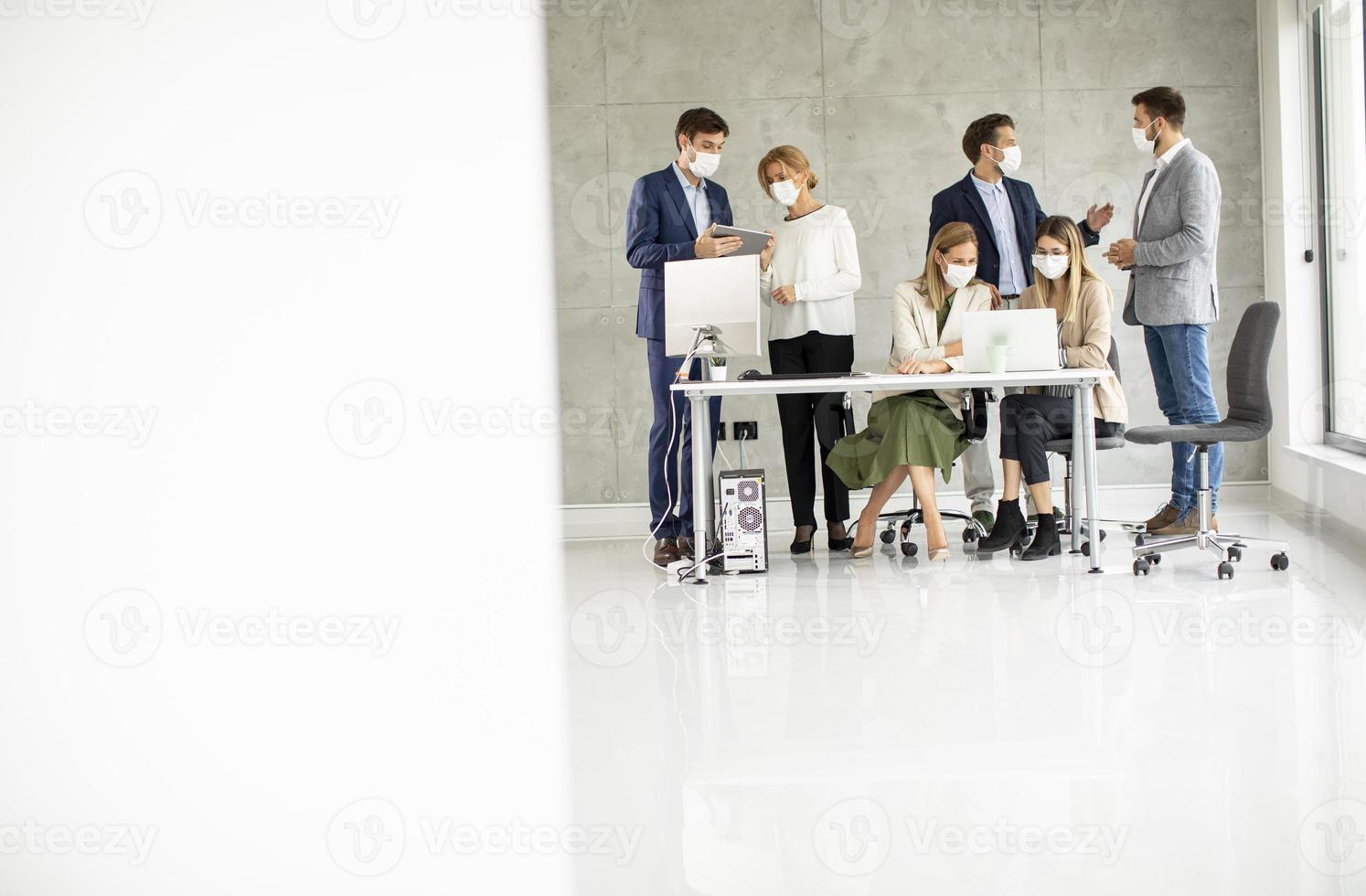 Group with masks on and copy space photo