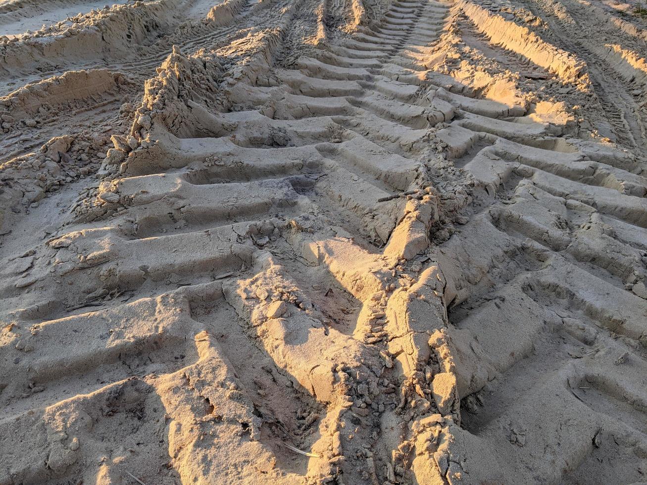 Tire tracks on the sand. photo