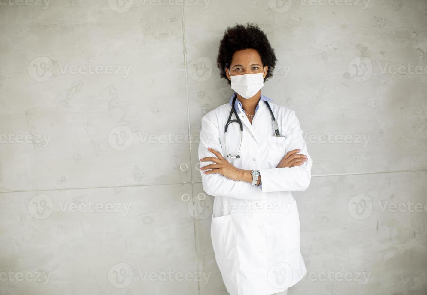 Masked doctor with copy space photo