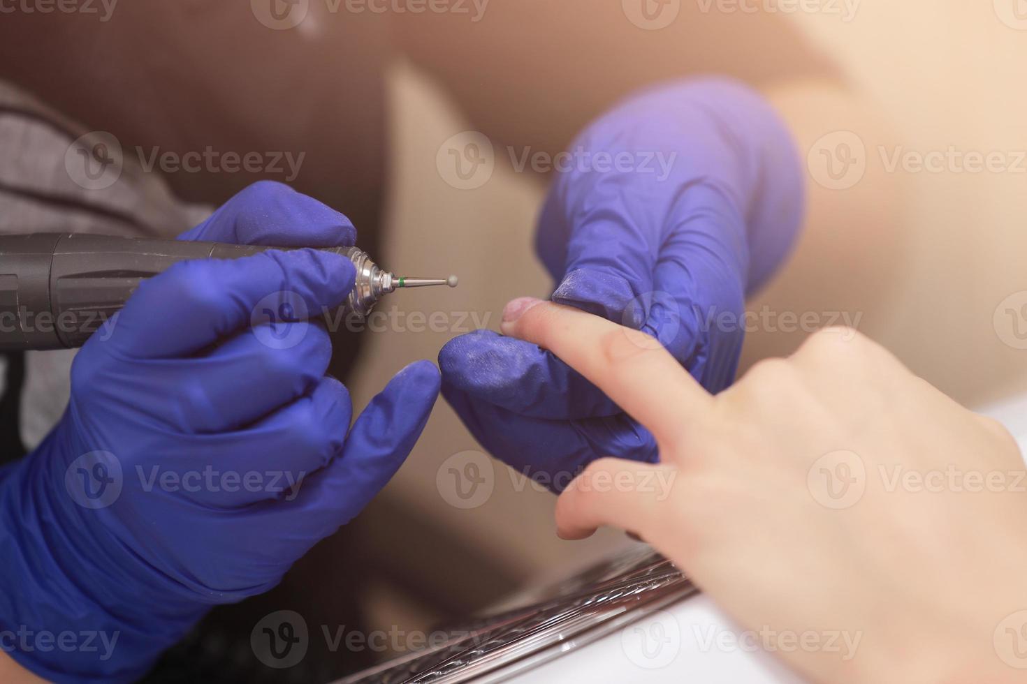 Close-up shot of hardware manicure in a beauty salon photo