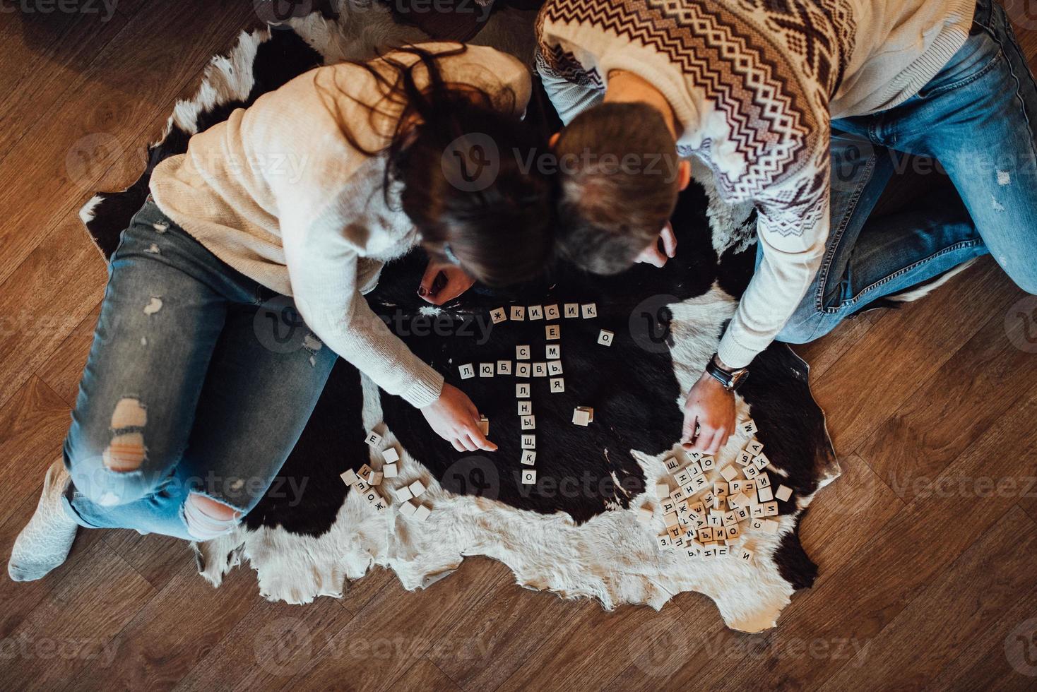 Guy and a girl celebrate the new year together and give each other gifts photo