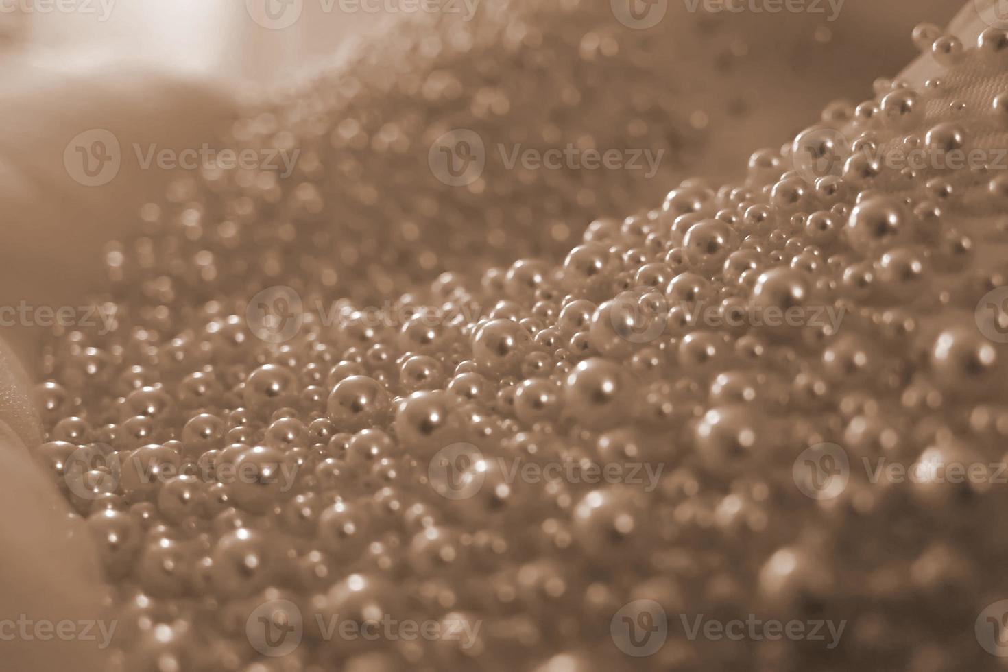Close-up of pearls on a bridal dress photo