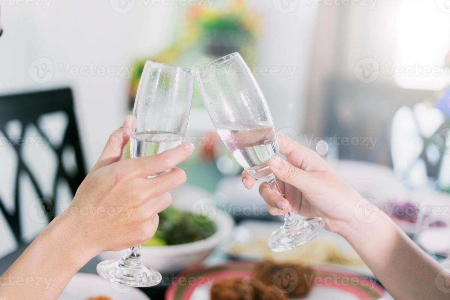 Clinking champagne flutes photo