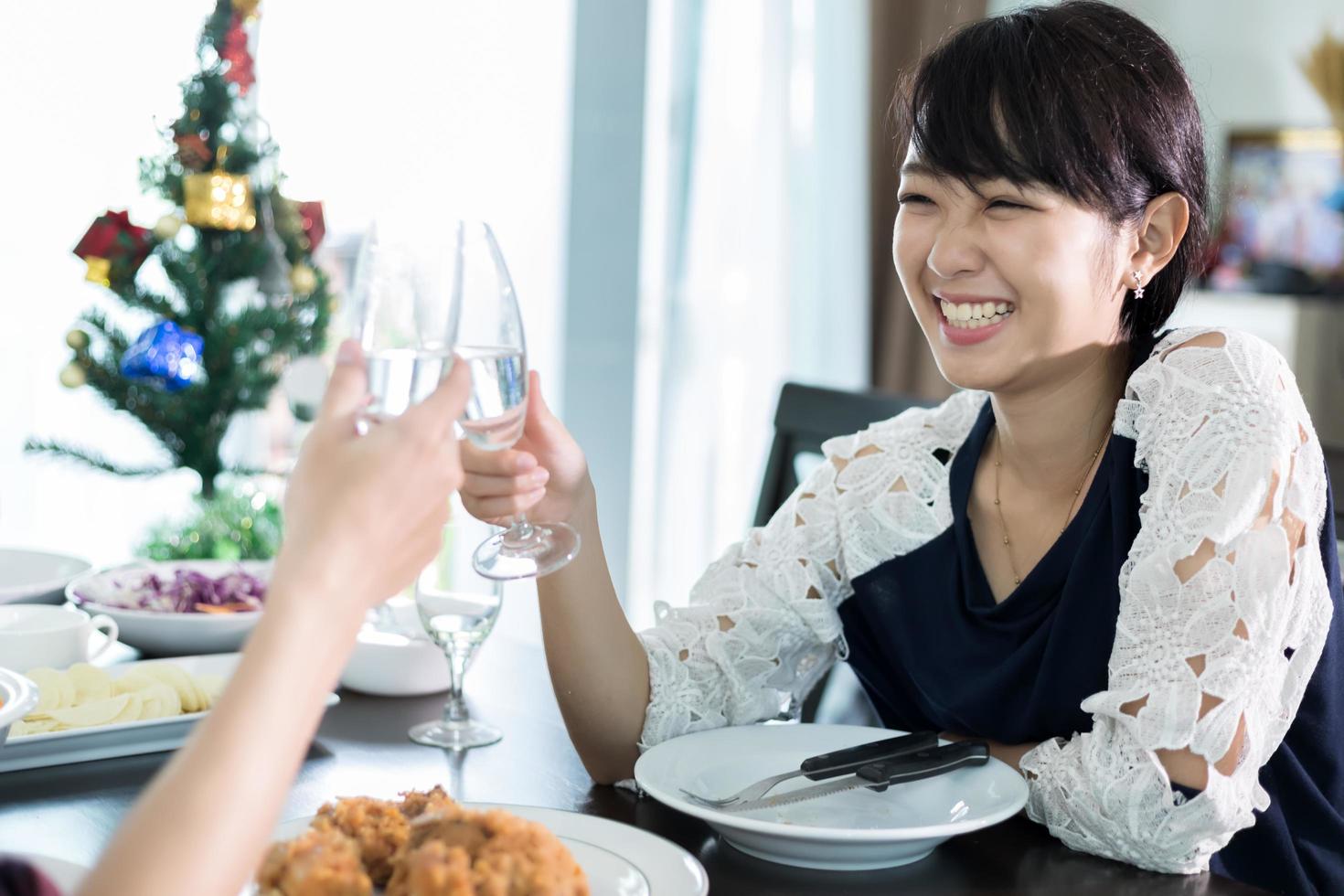 Woman clinking glasses with date photo
