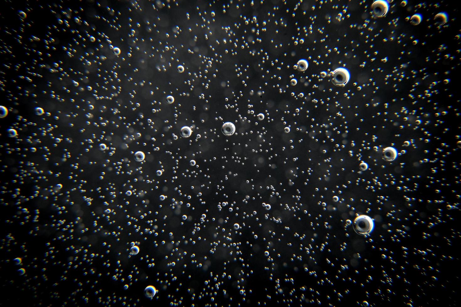 Black abstract background with bubbles photo