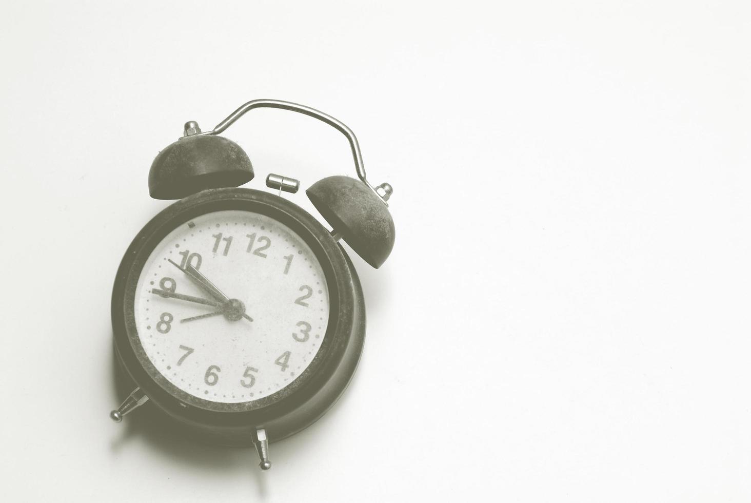 A retro style alarm clock on white background photo