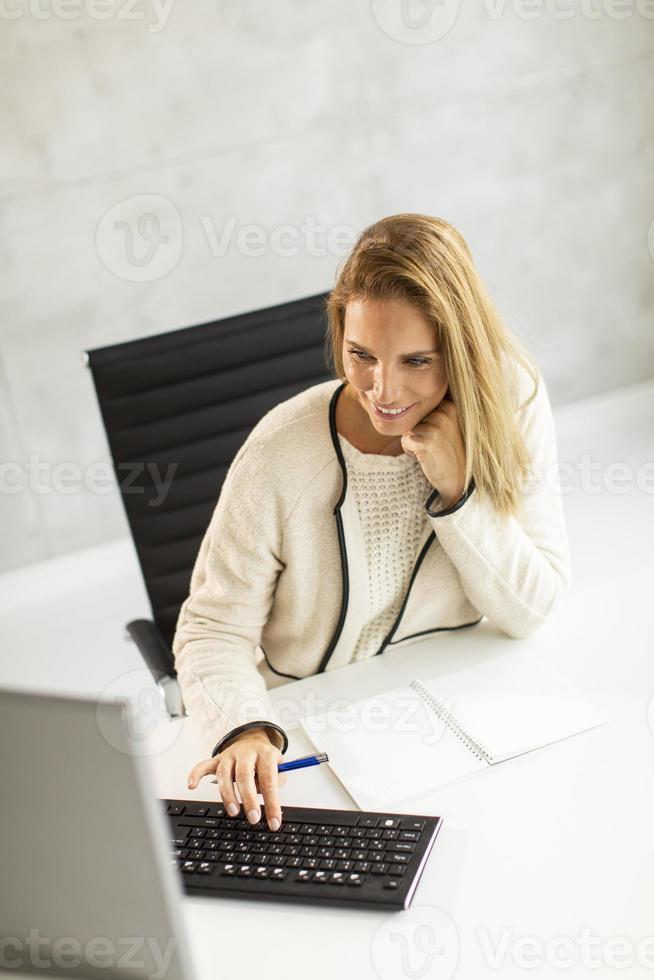 Top view of a businesswoman at desk photo