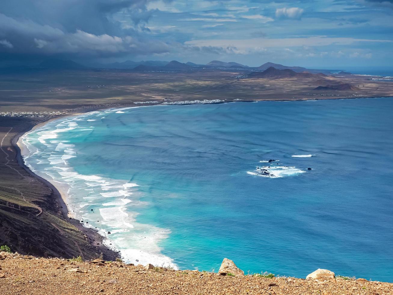 View over Famara beach and bay Lanzarote Canary Islands photo