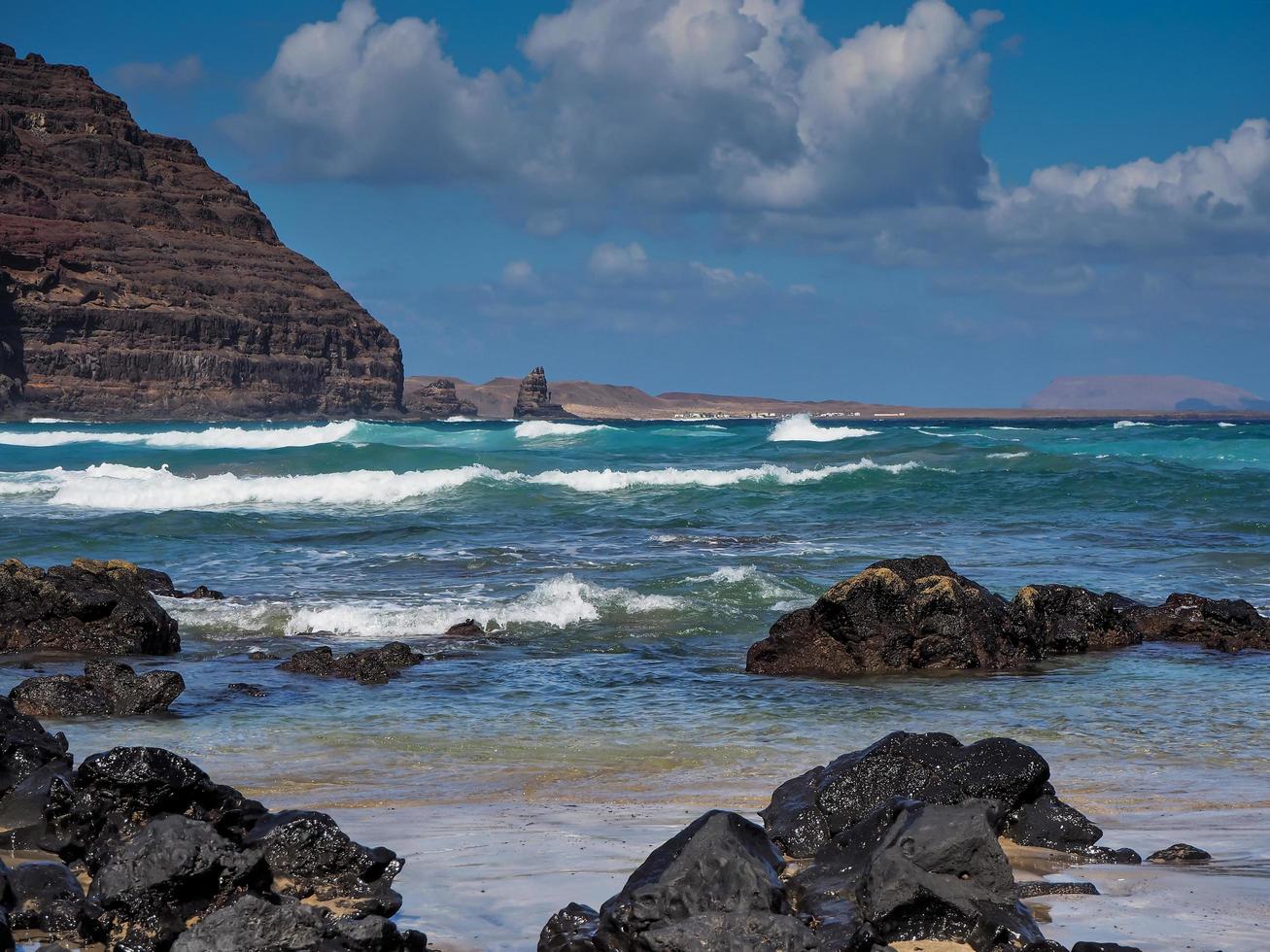 Waves approaching the coast at Orzola Lanzarote Canary Islands photo