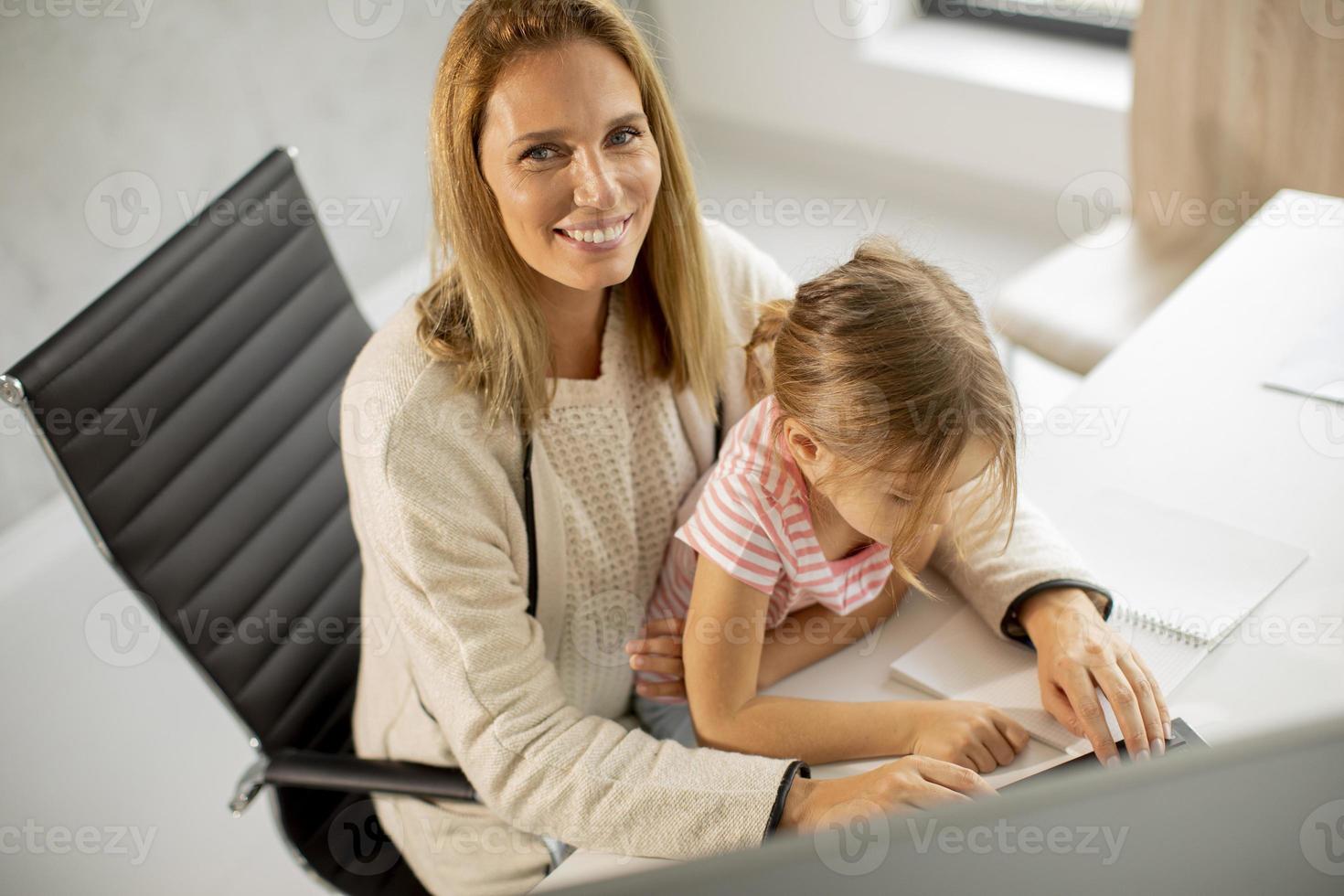 Mother and daughter in office photo