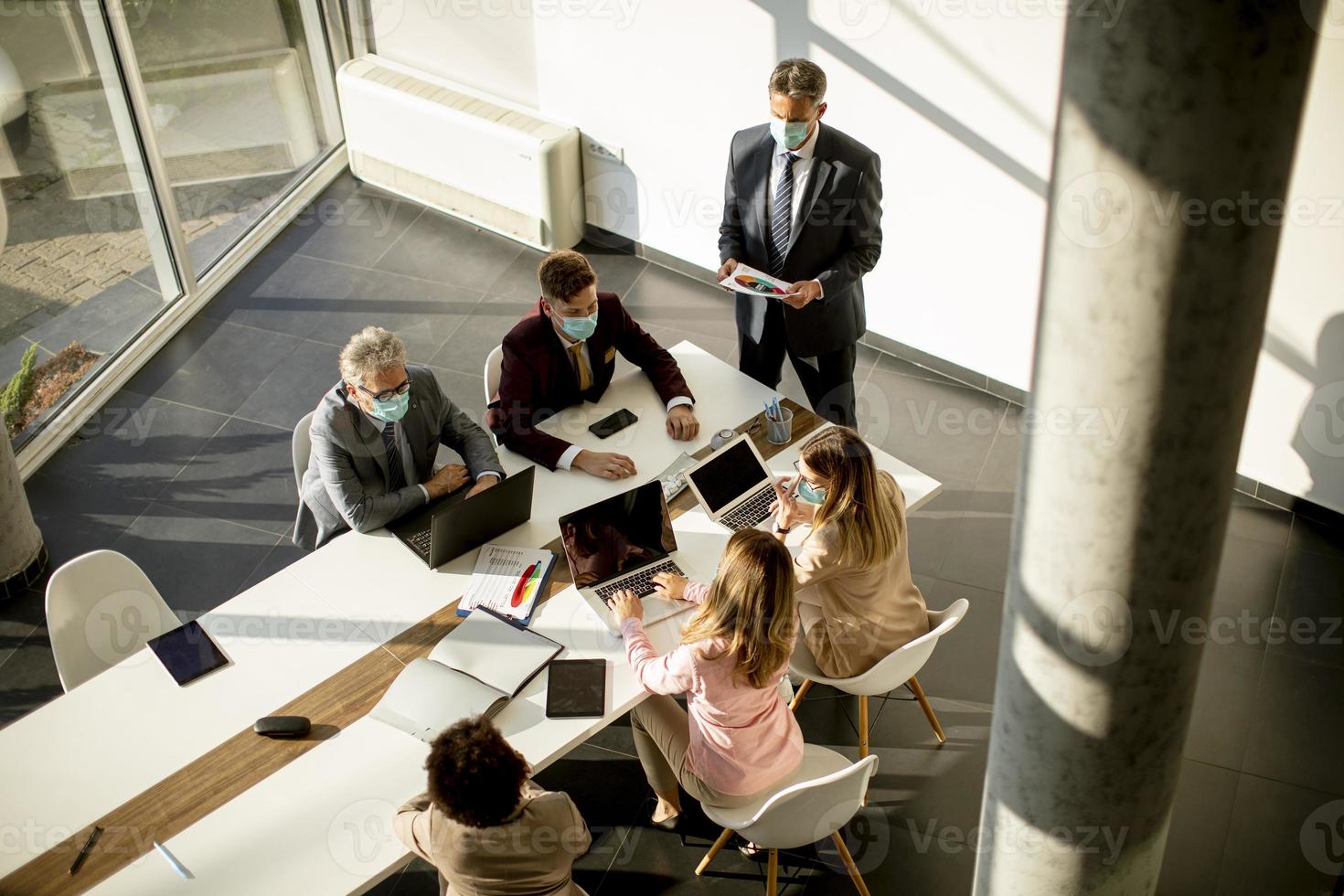 Aerial view of a meeting in a modern office photo