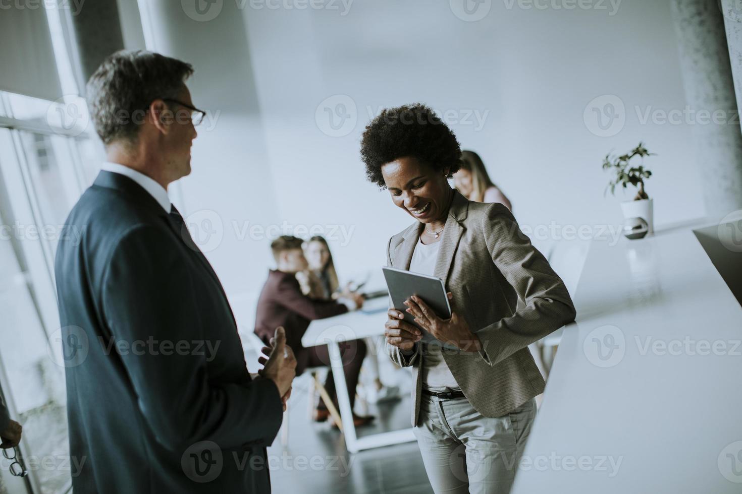 Two business people talking photo