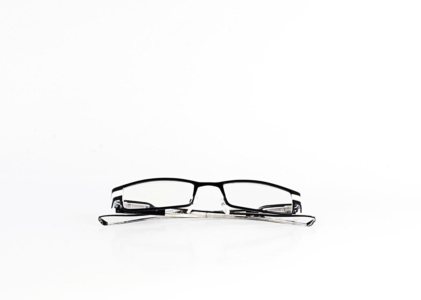 Close up of eyeglasses isolated on white background photo