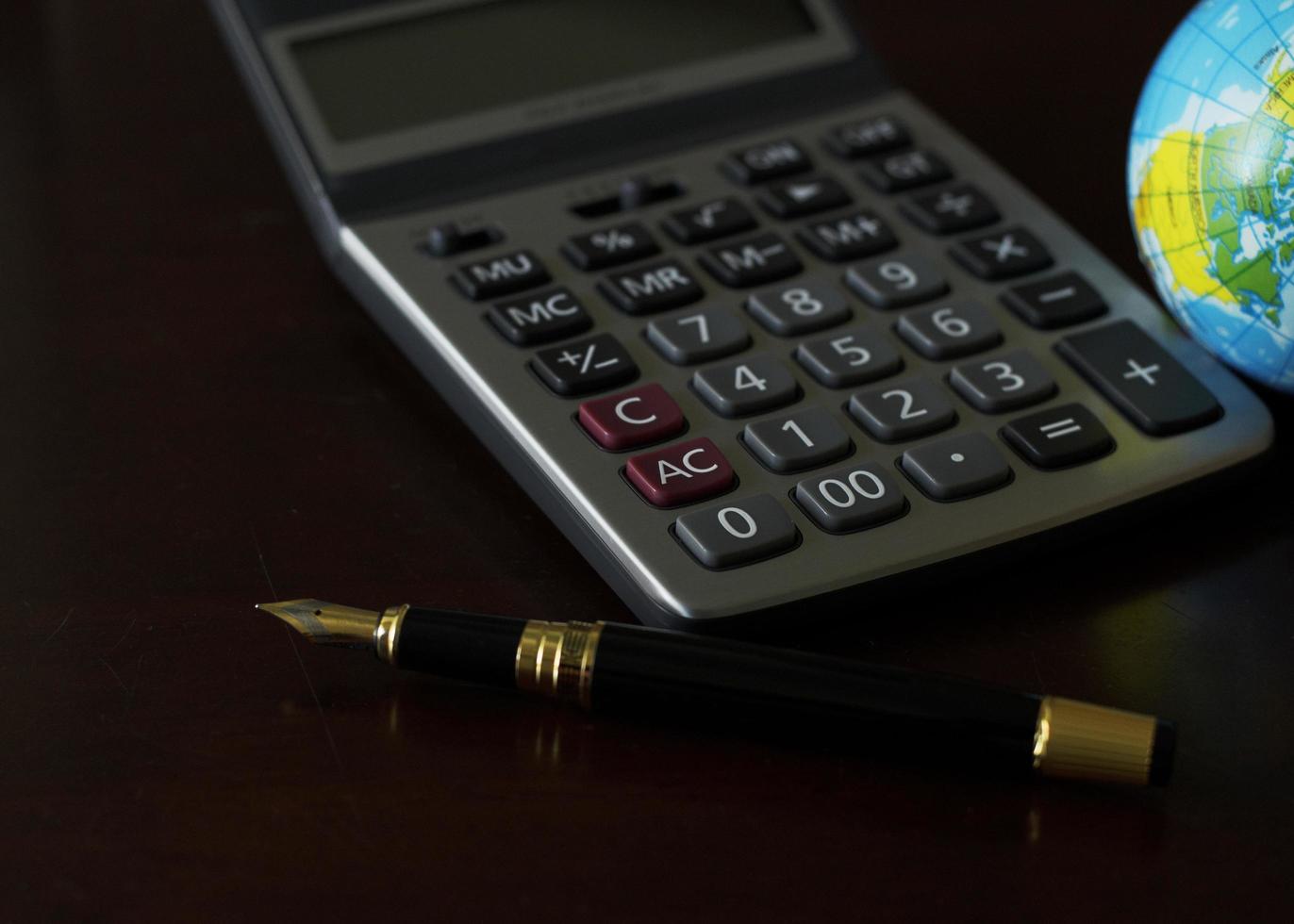 Coins money and calculator and credit card for loan money concept photo