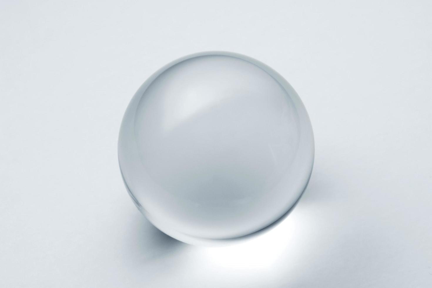 A lens ball in bright silver blue monochrome photo