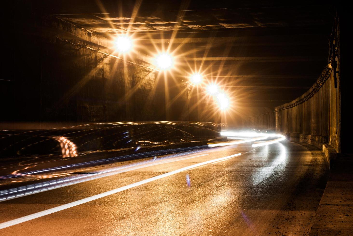 Old tunnel with bright light trails photo