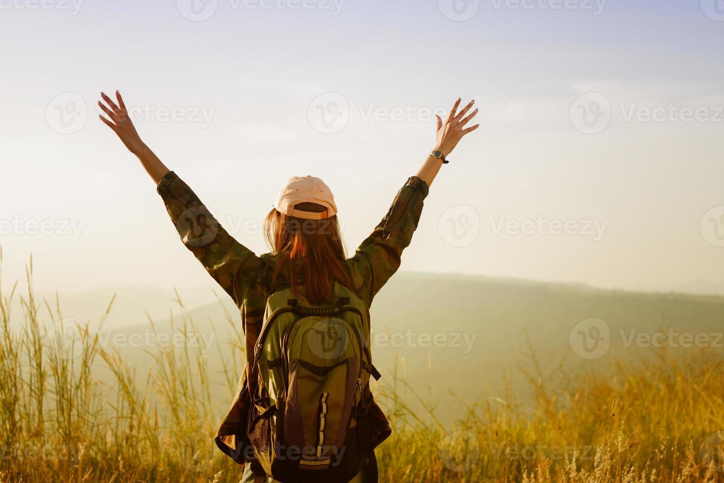 Woman celebrating on a hike photo