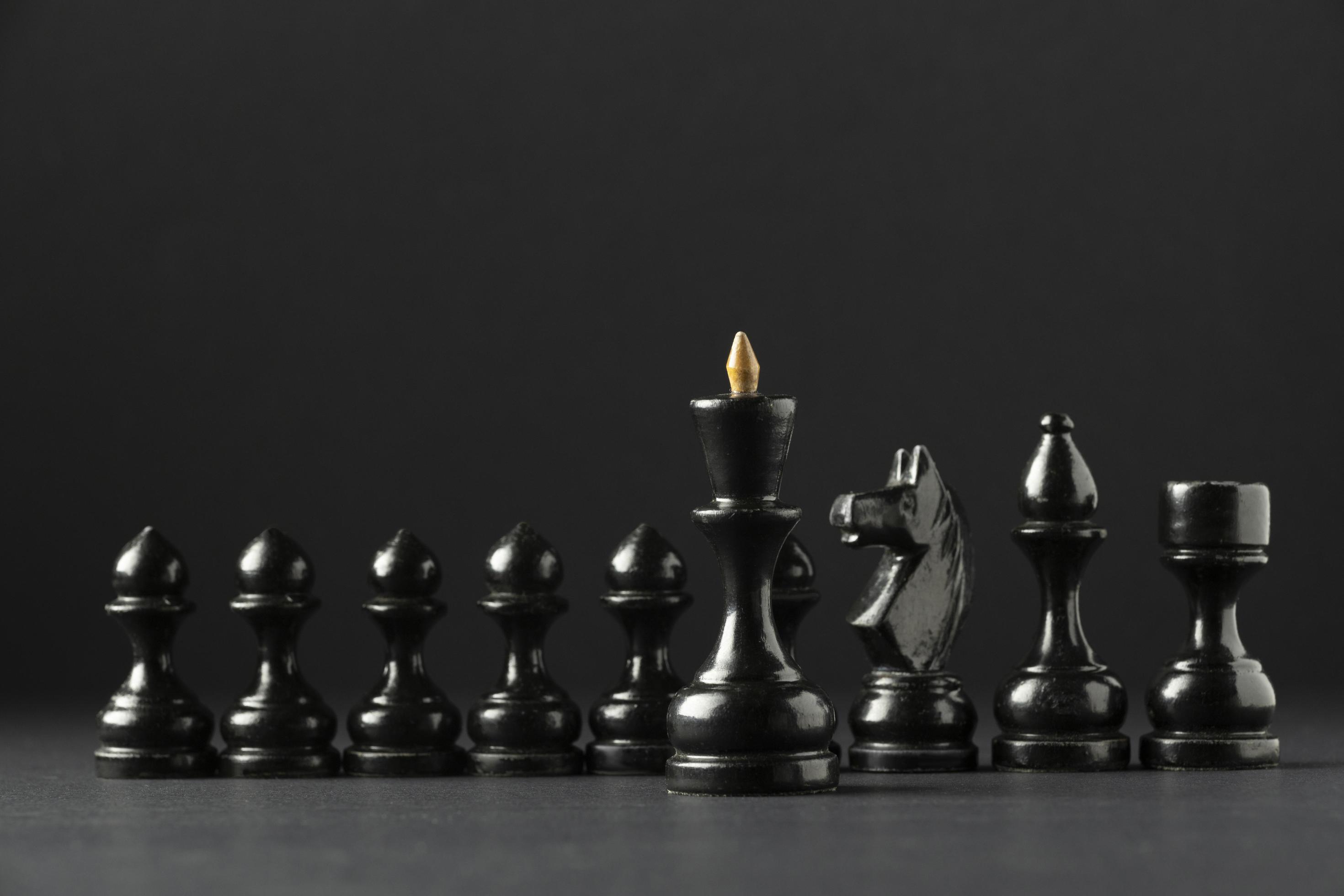 A Black Chess Game With Black Pieces Background Wallpaper Image