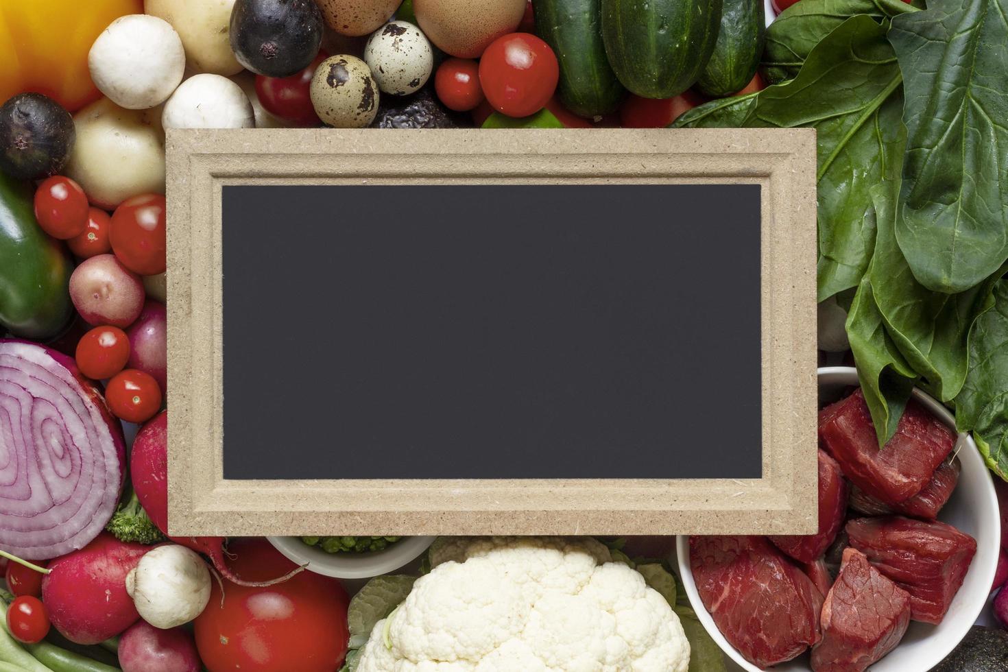 Healthy whole foods composition with chalk board for copy space photo